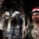 An Iraqi Christian soldier stands at the Grand Immaculate Church during the first mass since it was recaptured from Islamic State in Qaraqosh